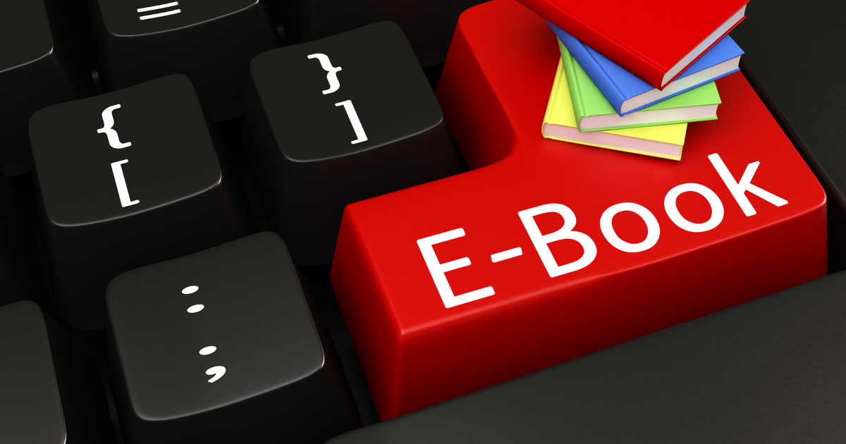 Clavier d’ordinateur avec une touche rouge “ebook” pour illustrer créer un ebook Canva